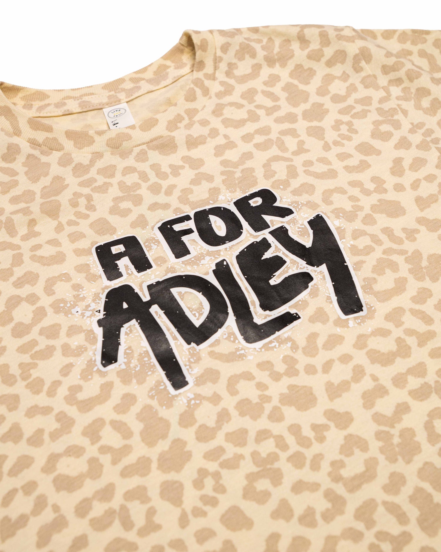 Adley's Spray Logo Tee (cream cheetah print)